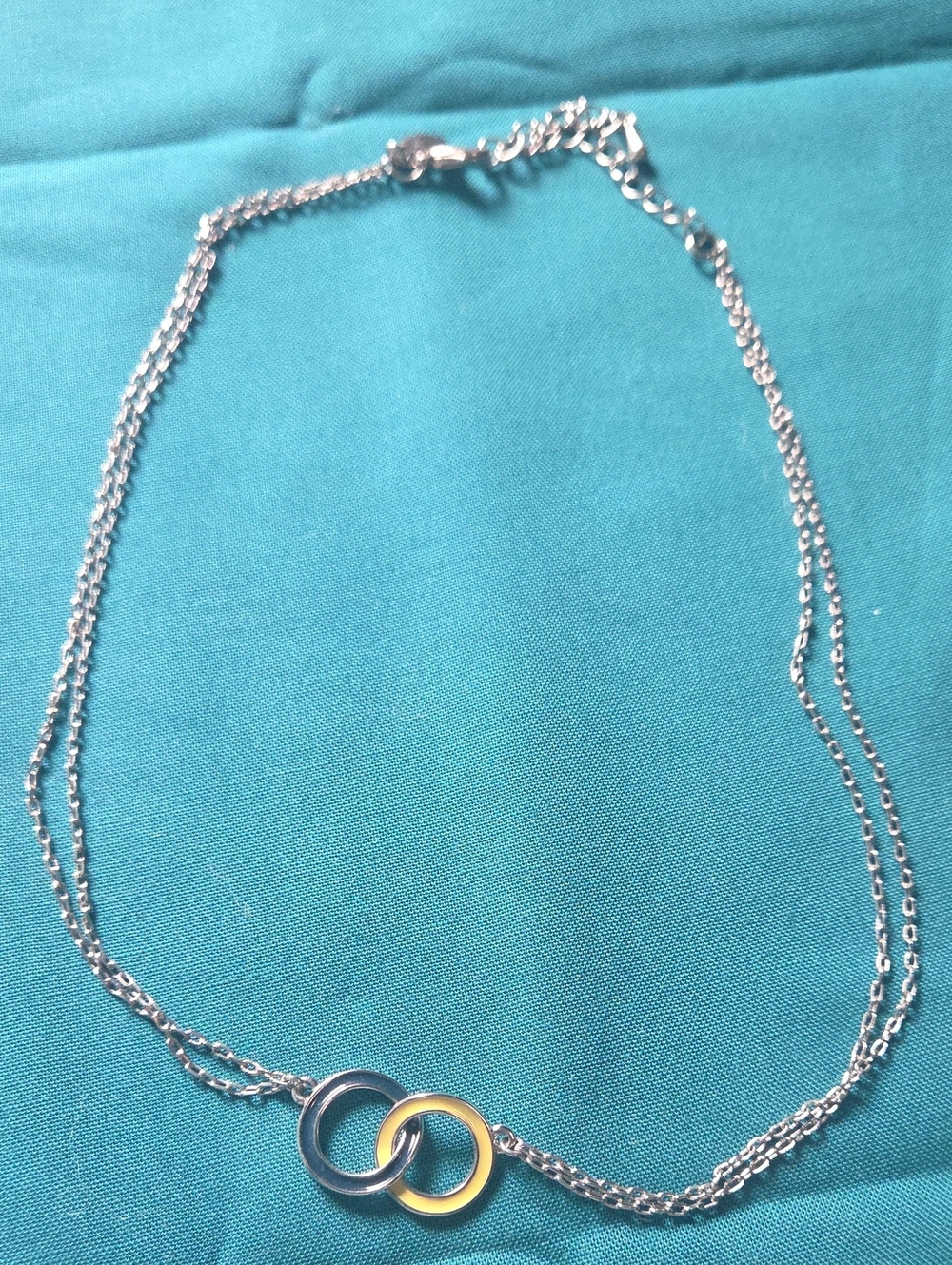 Lia Sophia Two-Ring Interlock Necklace in Silver and Gold Tones